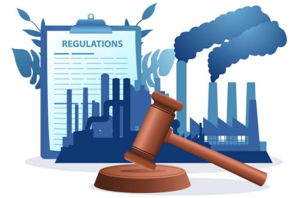 Gavel justice hammer with polluted factories in the background, carbon and emission regulation, pollution control concept